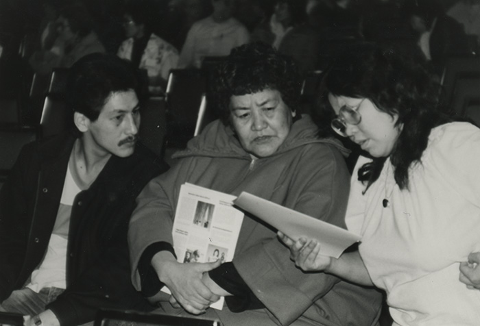 3 people reading a document